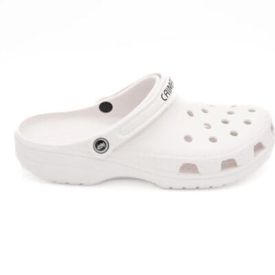 A white shoe with holes on the side of it.