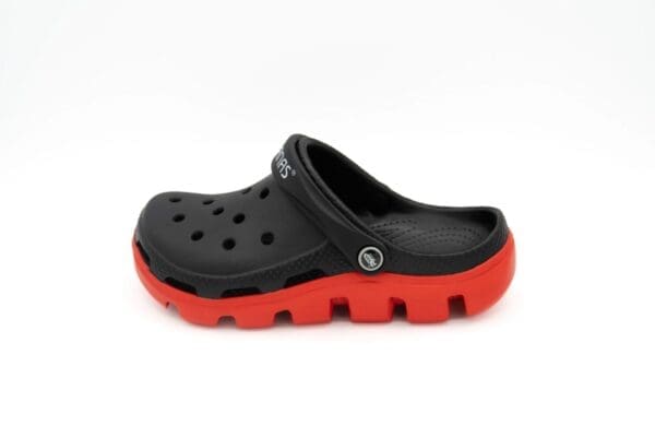 A pair of black and red crocs on a white background