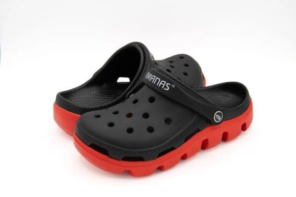 A pair of black and red crocs shoes.