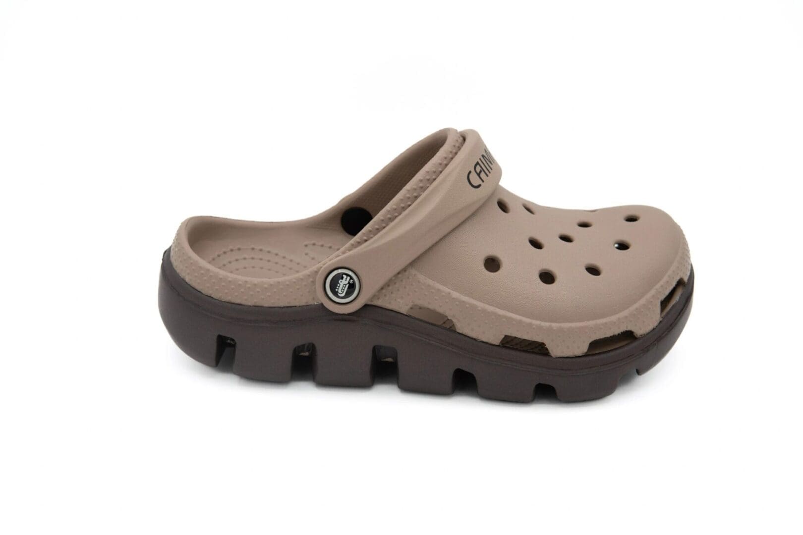 A pair of brown crocs with a black sole.