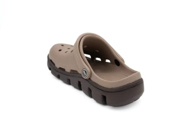 A pair of brown sandals on top of a white background.