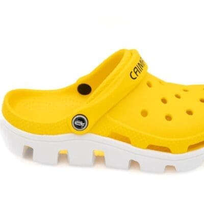 A close up of the bottom part of a pair of yellow crocs