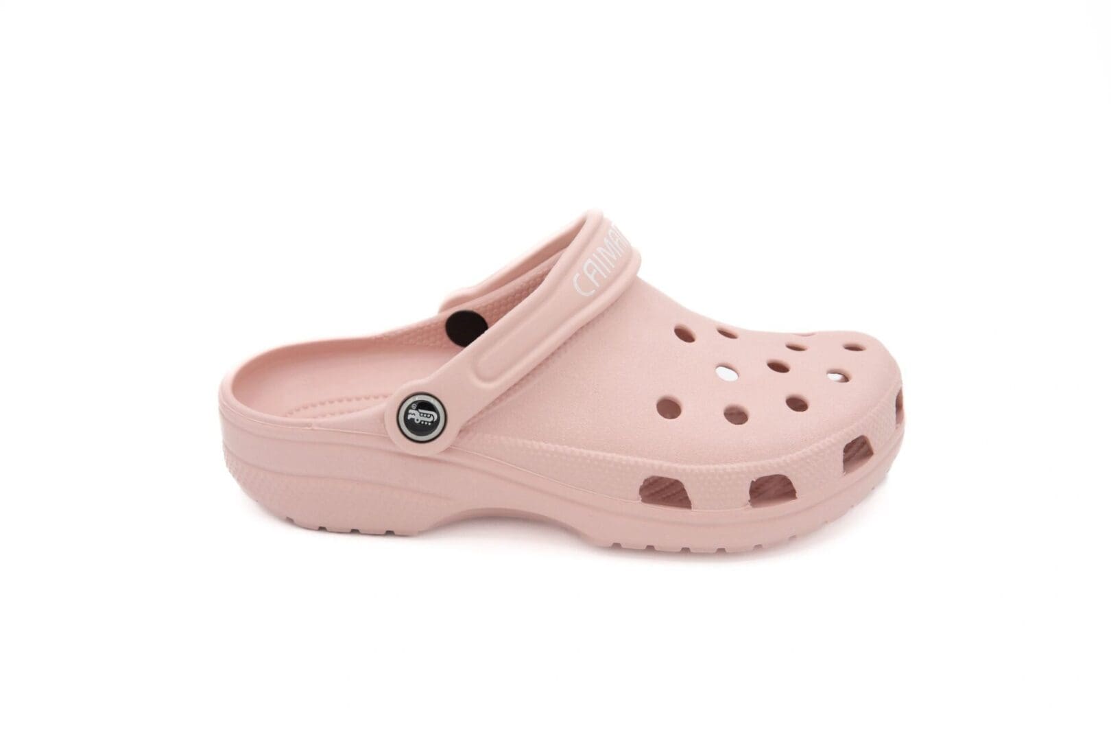 A pair of pink crocs with a button on the side.