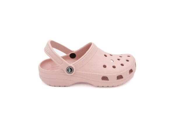 A pair of pink crocs with a button on the side.